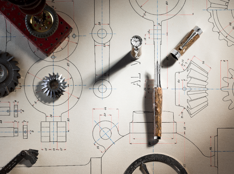 Luxury fountain pen displayed on detailed mechanical blueprints, symbolizing precision craftsmanship and fine engineering excellence